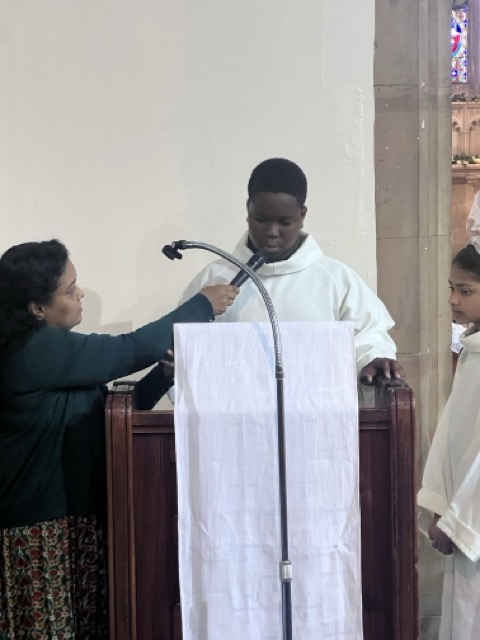 Children, servers, and parishioners gathered during Family Eucharist