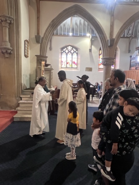 Families waiting in line during Communion